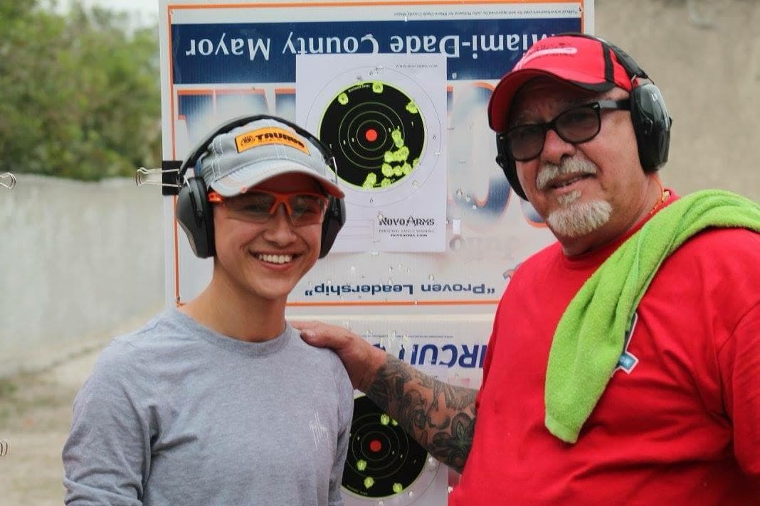Marino Radillo with a student after firearms training